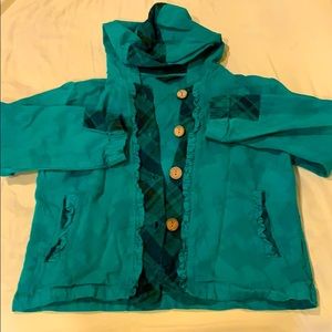 Green jacket with wooden buttons